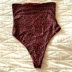 Reversible polka dot/ animal print strapless swimsuit cheeky cut
